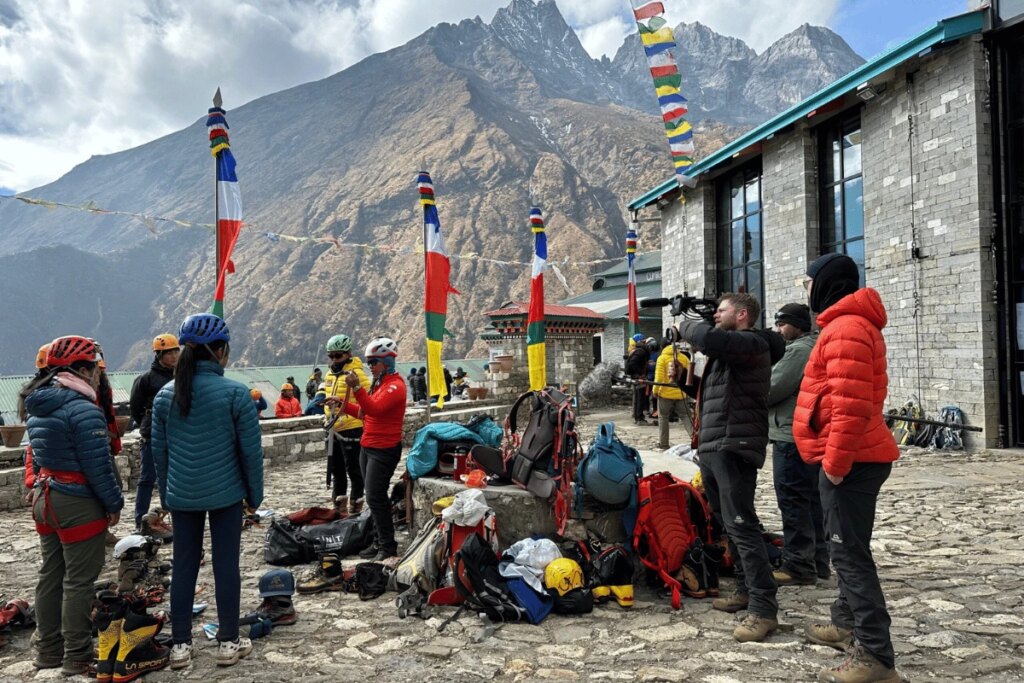 On Site Gear Nepal: The Essential Equipment Support Every International Filmmaker Needs International film crew and site film gear support with camera equipment and climbing gear preparing for a high altitude production shoot in the himalayan mountains of nepal