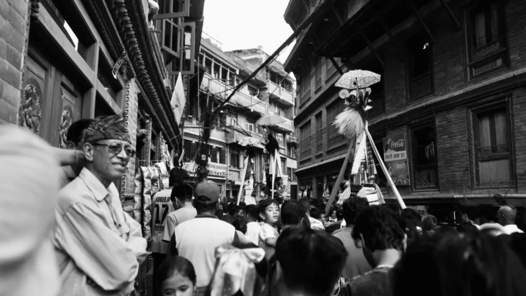 Flim maker capturing a cultural scene in Nepal during a traditional festival to film in nepal