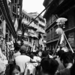 Flim maker capturing a cultural scene in Nepal during a traditional festival to film in nepal