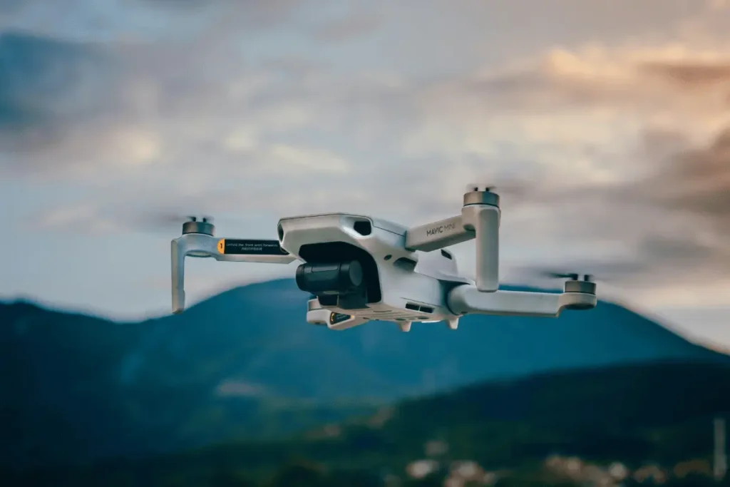 Drone filming logistics and regulations in Nepal with aerial camera capturing Himalayan mountain landscapes