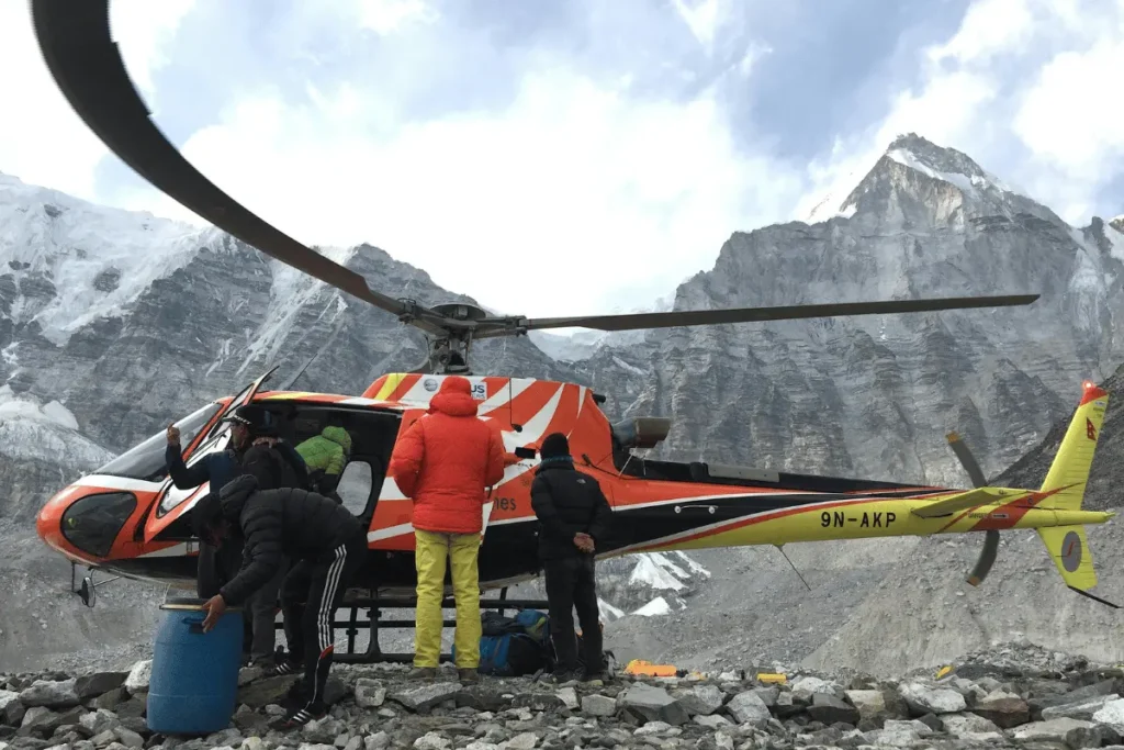 Helicopter support for filming logistics in Nepal transporting crew and camera equipment to remote mountain locations