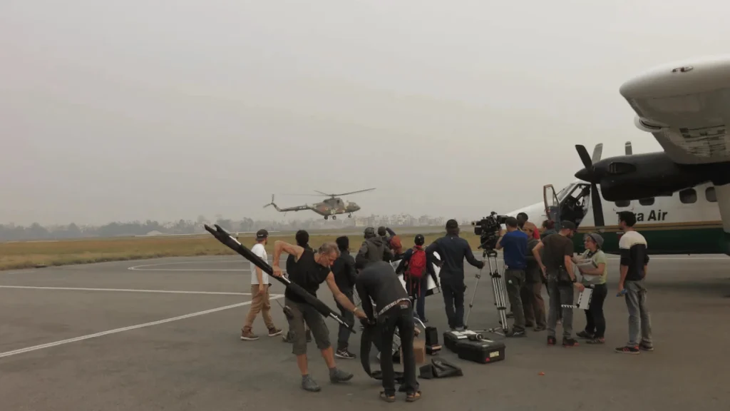 Customs Clearance for Film Equipment in Nepal: What Foreign Crews Need to Know Foreign crew unloading film equipments for customs clearance for filming in nepal